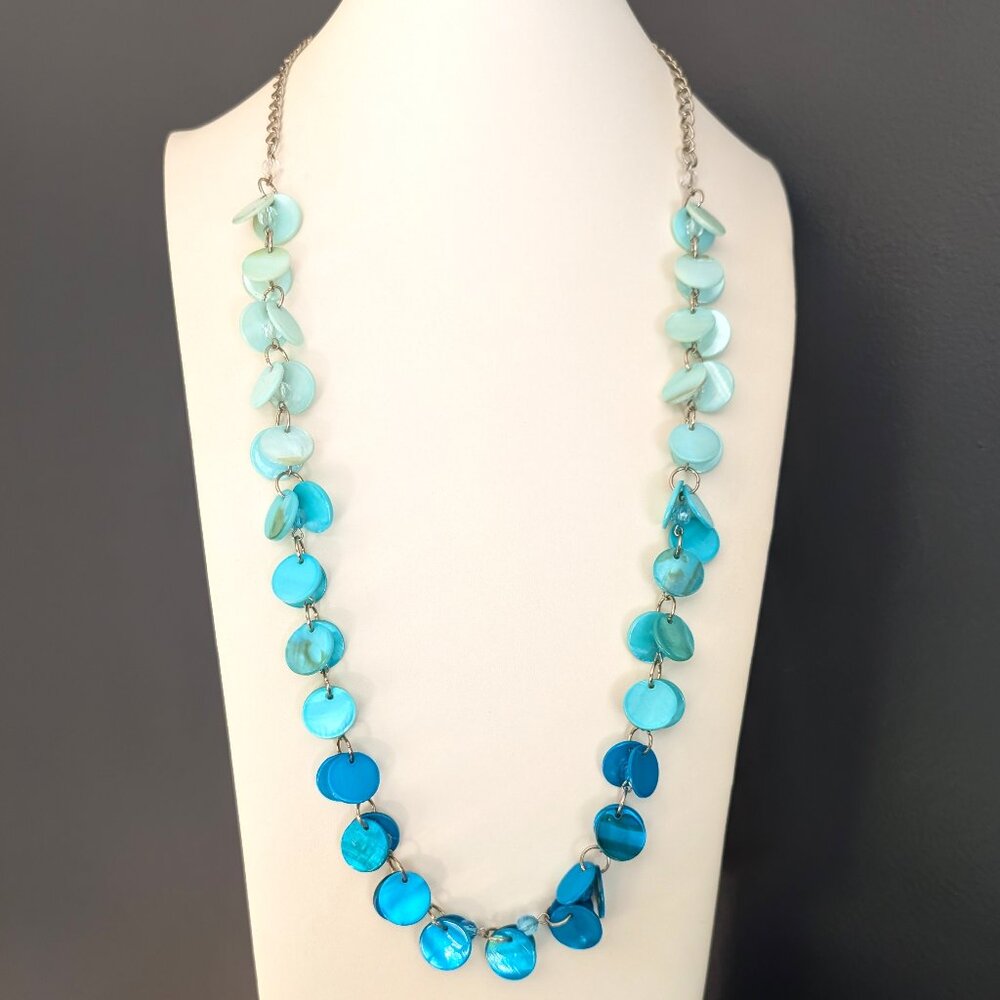 Shades of blue dyed shell necklace with faceted bead accents